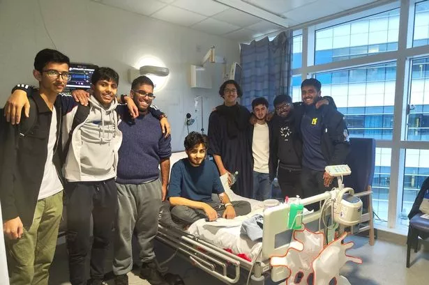 18-year-old student Ahmed Qureshi surrounded by friends 