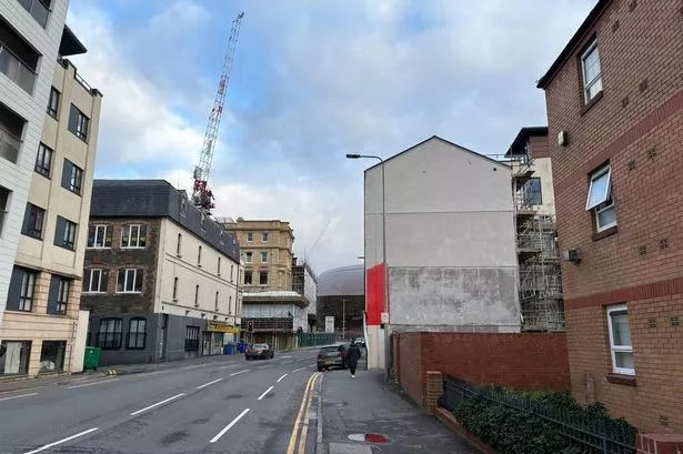 A cream wall has appeared in place of the impressive mural