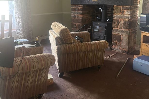 A living room with furniture everywhere and carpets soaking 