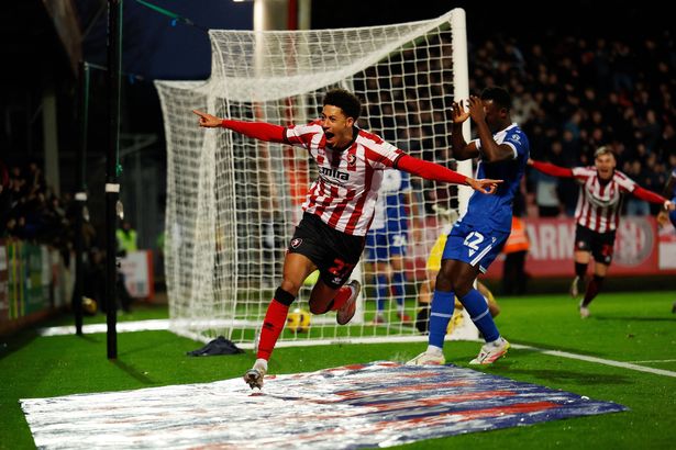 Jonathan Tomkinson of Cheltenham Town celebrates scoring a goal to make it 1-0