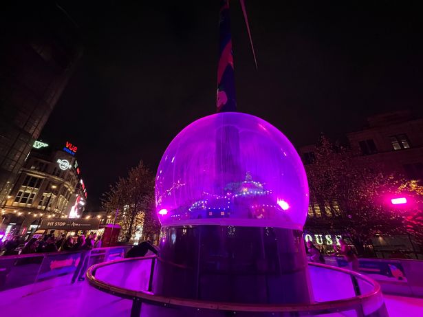 This year's rink features a wind turbine with a giant snow globe attached