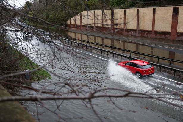Flooding on the A555 Airport Relief Road in Handforth following Storm Claudia