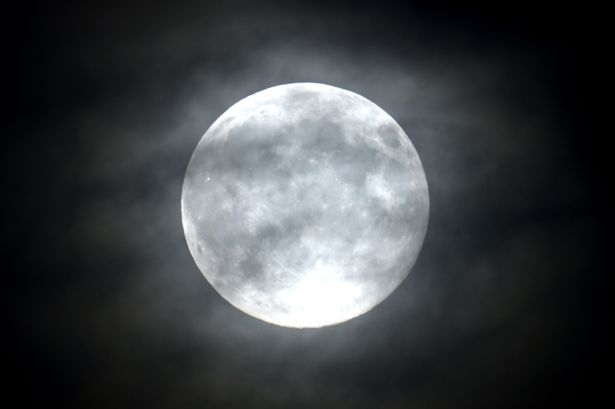 MOSCOW, RUSSIA - NOVEMBER 05: The full moon, also known as 'Beaver Moon',  rises behind the clouds in Moscow, Russia on November 05, 2025. (Photo by Sefa Karacan/Anadolu via Getty Images)