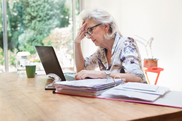 Older woman sorting finances