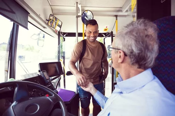 Man paying to get on bus