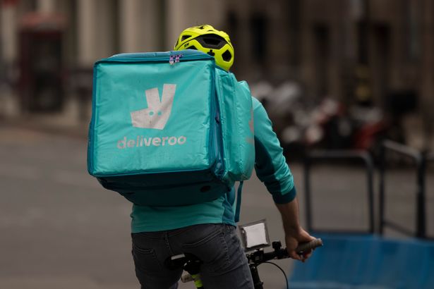 A Deliveroo rider near Victoria station on March 31, 2021 in London