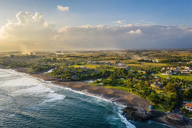 Dramatic aerial view of the pererenan beach in northern Canggu in Bali, Indonesia in late afternoon.