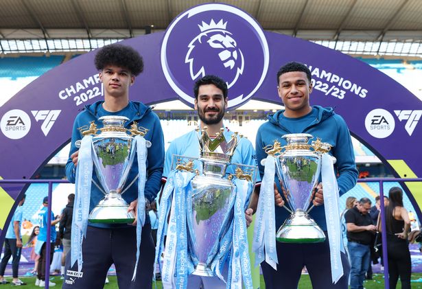 Nico O'Reilly with Ilkay Gundogan and Shea Charles in 2023 as Manchester City celebrated Premier League title wins across the age groups