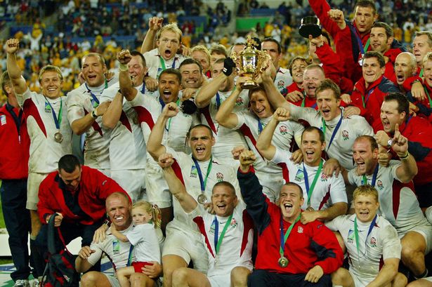 England's team poses with the Webb Ellis Cup after the 2003 Rugby World Cup final