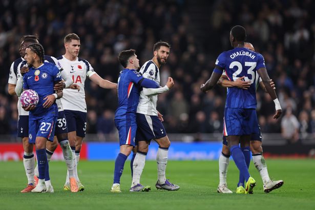 Rodrigo Bentancur of Tottenham Hotspur clashes with Trevoh Chalobah of Chelsea
