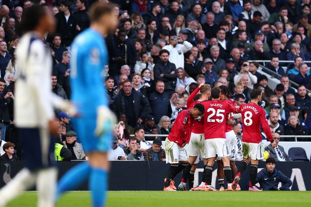 Manchester United players celebrate after rescuing a draw against Tottenham Hotspur in the Premier League