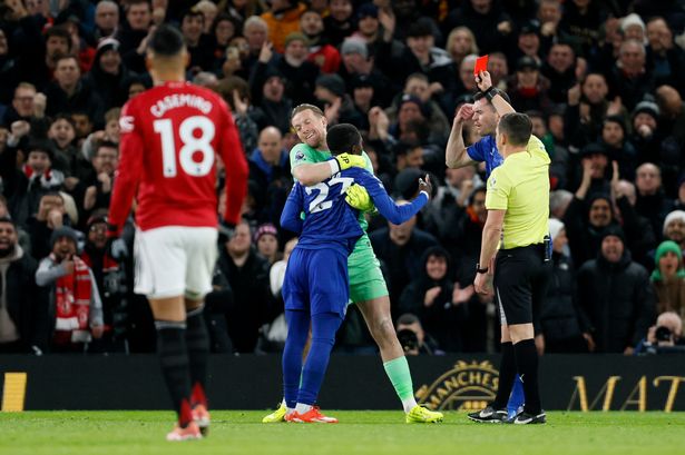 Idrissa Gueye is restrained as he is sent off during Everton's win over Manchester United