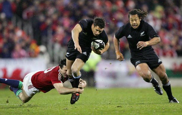 Stephen Jones (tackler) played against Tana Umaga (right)
