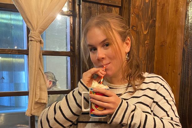 Amy drinking a baileys hot chocolate