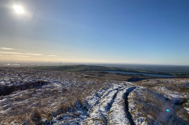 The roving hills as seen from Scout Moor with views of Manchester in the background