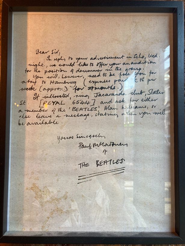 A reproduction of the letter written by Paul to the mystery drummer hangs in the Jacaranda.