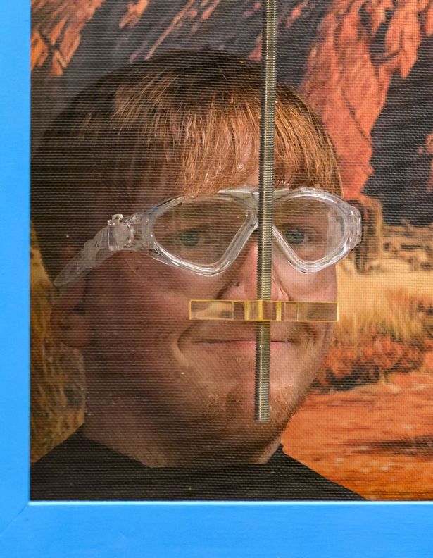 AngryGinge with head in a box during trial