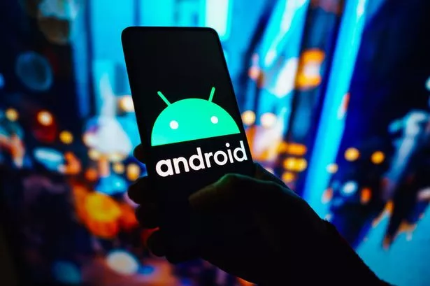  A picture of a hand holding an Android phone