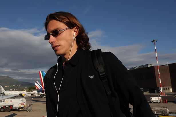 Riccardo Calafiori boards a plane