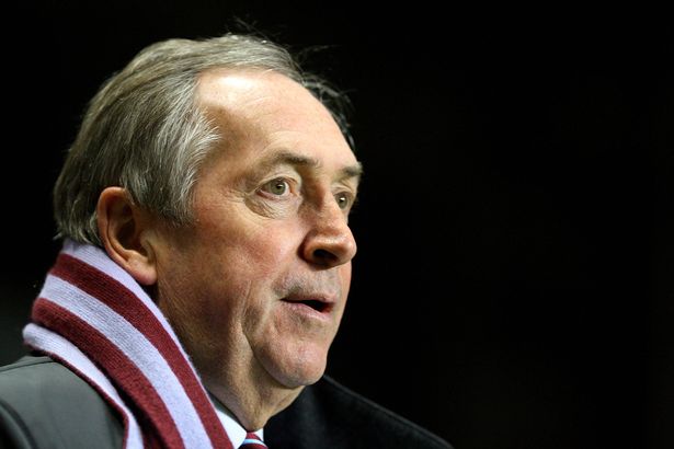 Gerard Houllier looks on