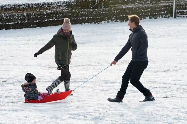A family take advantage of the Christmas Day snow