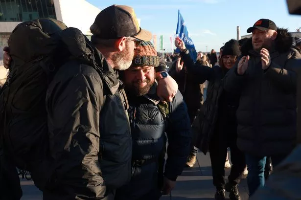 Elle Edwards' dad, Tim Edwards, and actor John May arrive at Liverpool's Pier Head on their Lands End to John O'Groats walk for charity