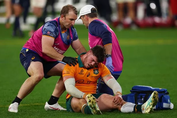  Carlo Tizzano of the Wallabies receives medical attention