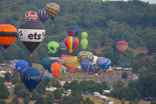 The first mass ascent of the 47th Bristol International Balloon Fiesta 2025 - Friday, August 8 - at Ashton Court Estate