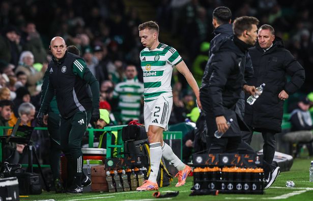 Celtic's Alistair Johnston  leaves the field with an injury 