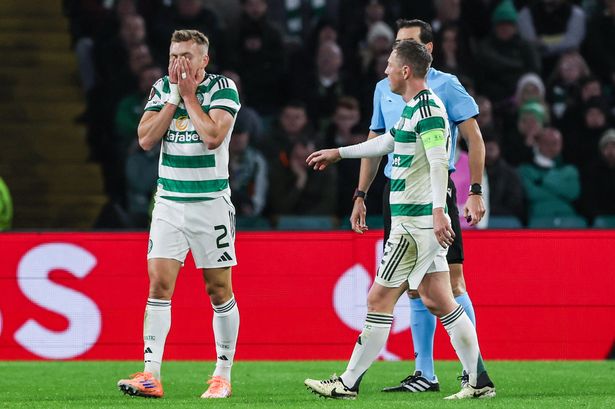 Celtic's Alistair Johnston leaves the field with an injury 