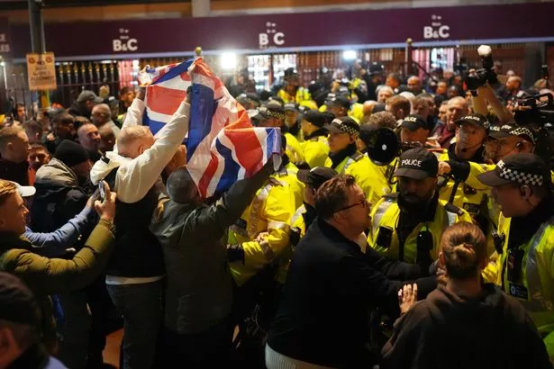 Police officers keep different groups apart outside the ground at the Aston Villa and Maccabi Tel Aviv Europa League football match on November 06, 2025 in Birmingham, England. 