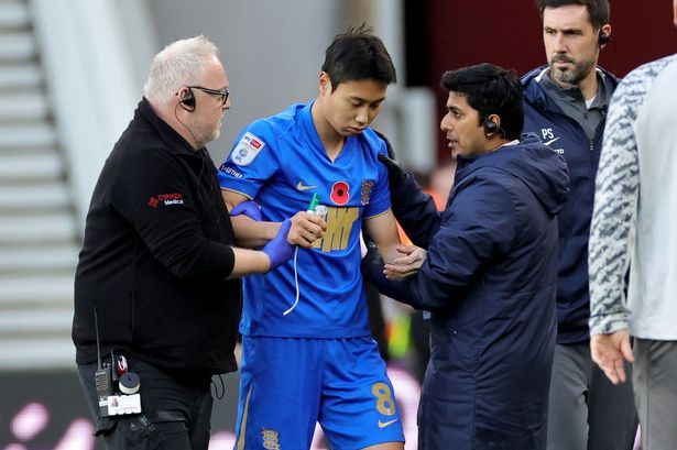 Birmingham City's Paik Seung-ho (centre) is helped from the pitch