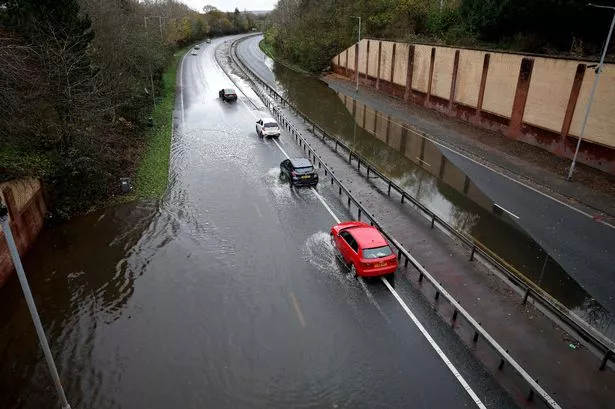 Flooding on the A555 Airport Relief Road after Storm Claudia (Credit: Ryan Jenkinson / Manchester Evening News)