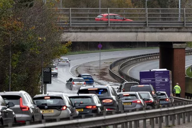 Drivers have faced disruption from flooding on the A555 (Credit: Ryan Jenkinson / Manchester Evening News)