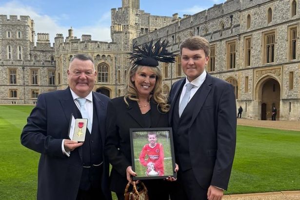 Mark, Joanne and Ben at Windsor Castle today holding a framed photo of Oliver King