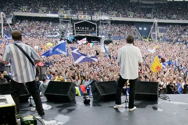 The Proclaimers perform on stage at the Live 8 Edinburgh concert at Murrayfield Stadium