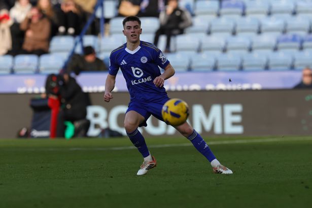 A number of empty seats can be seen behind Leicester City's Luke Thomas