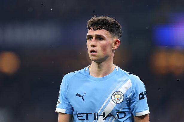Phil Foden looks on