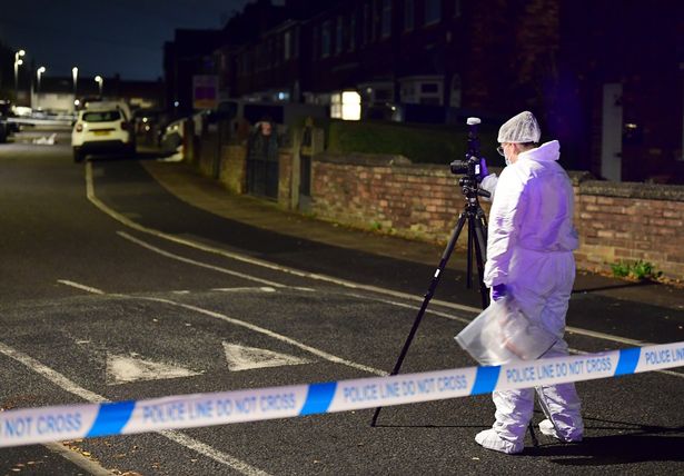 A forensic officer at the scene