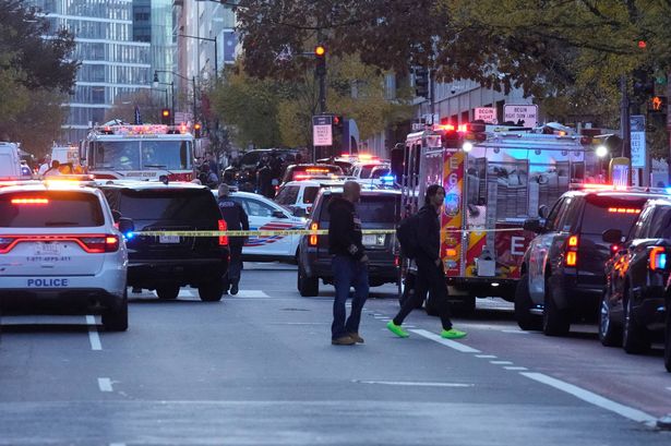 Emergency vehicles gather at a cordoned off area where National Guard soldiers appear to have been shot near the White House Wednesday, Nov. 26, 2025, in Washington. (AP Photo/Mark Schiefelbein)