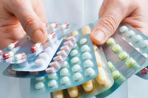Thinkstock generic image of a doctor holding lots of tablets / medicine