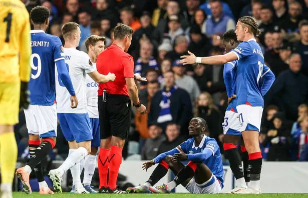 Referee Matej Jug awards Rangers' Mohamed Diomande with a red card 