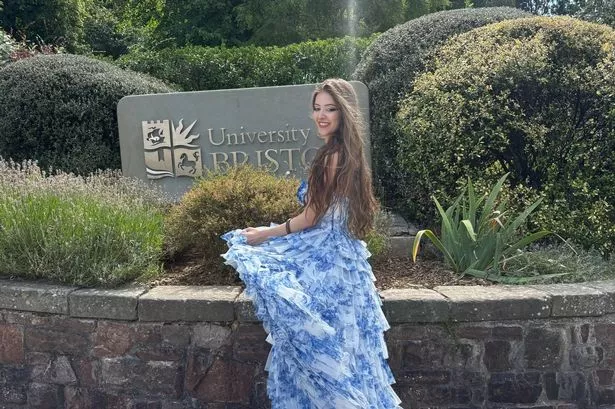 A woman outside a university