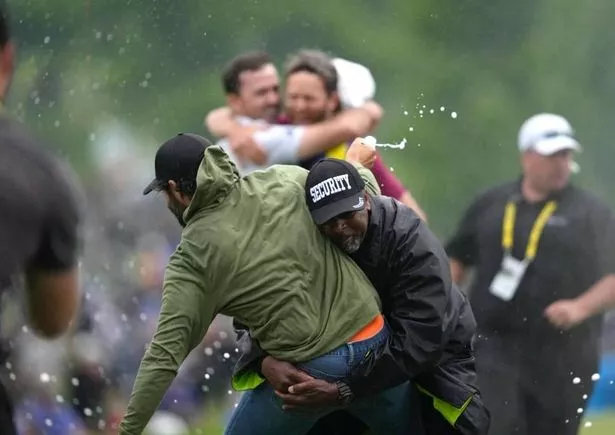 Adam Hadwin is tackled by security at the 2023 Canadian Open