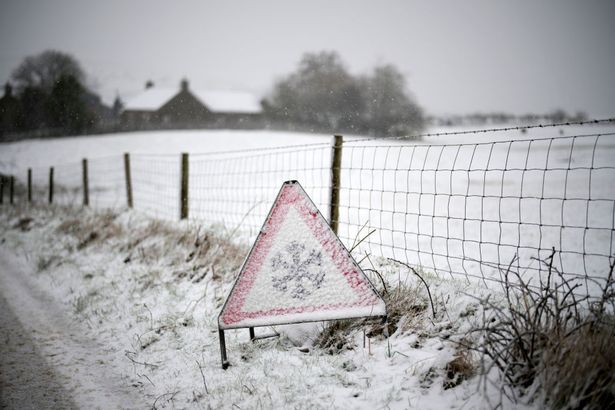An ice warning sign is covered in snow in the Peak District on February 08, 2024 in Buxton United Kingdom.