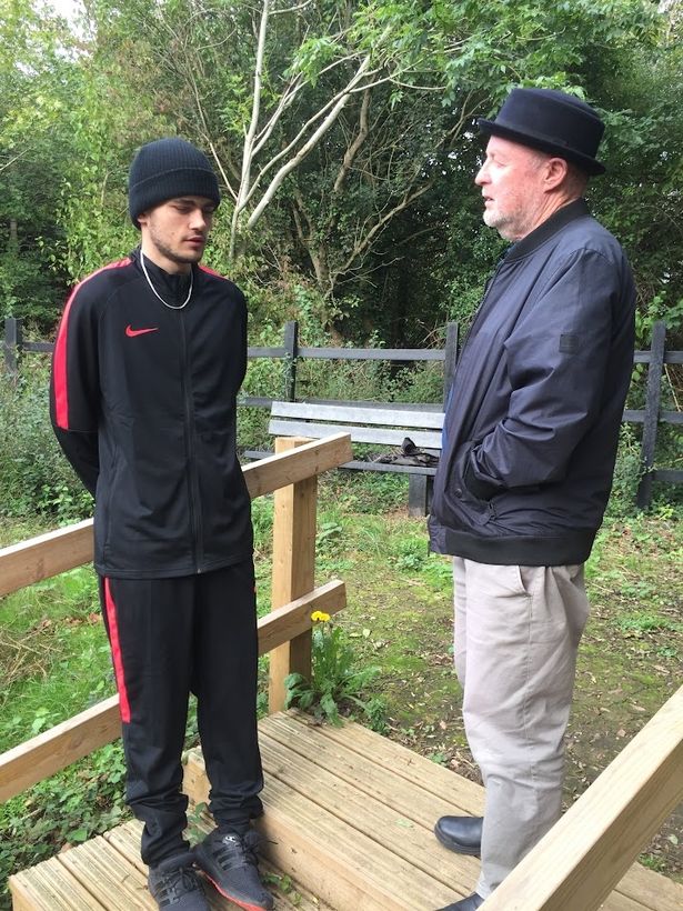 Foster carer John Stokes has published a book about his 35 years as Bristol's most prolific foster carer, pictured here chatting to Marcus, one of the 100 teenagers he fostered