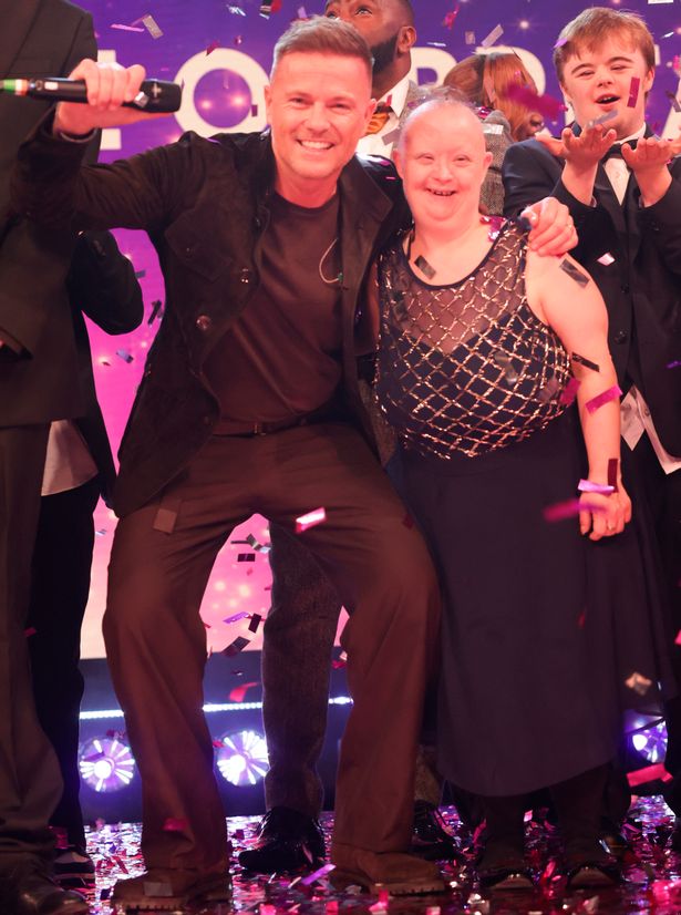 Nicky Byrne of Westlife performing with a member of Ups & Downs