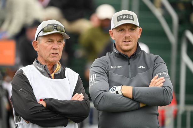 Matt Wallace of England (R) and his caddie, David McNeilly, look on from the 17th tee during the second round of the 2019 U.S. Open