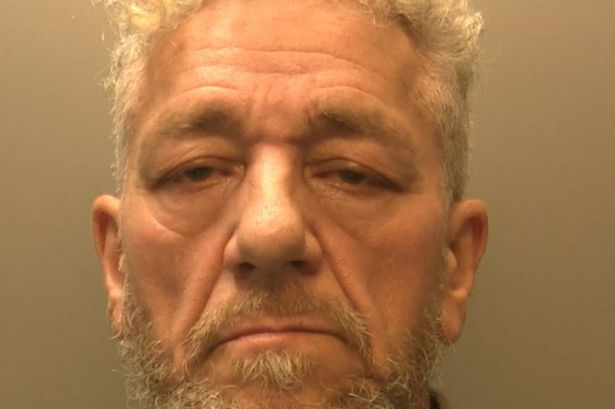 The image shows a glum looking Manson with curly white hair and fair skin. He is 68