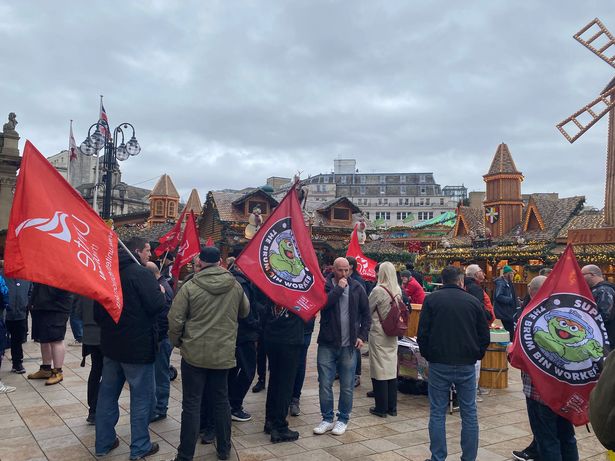 Members of Unite the union gather outside Birmingham Council House on November 4